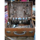A small leather suitcase with silver-mounted fittings - various dates