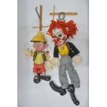 Two large-scale Pelham Puppets - Pinnochio and Bimbo the Clown - both boxed
