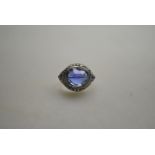 An early 20th century cabochon sapphire and diamond ring,