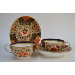 A pair of Stevenson & Hancock, Derby, cabinet teacups and saucers,