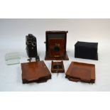A Clydesdale Set quarter plate field camera, with two double plate cases, black hood and tripod,