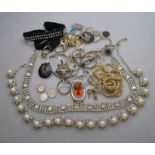 A collection of costume jewellery and coins including paste and imitation pearl cluster necklace,
