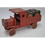 A pre-war vintage painted wood toy truck inscribed 'Pratts Spirit',
