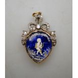A Georgian heart-shaped pendant featuring Cupid amongst flowers on a blue enamelled background,