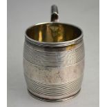 A small George III silver barrel-shaped mug with banded reeding,