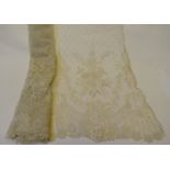 Two flounces of late 19th century Brussels needle-run lace worked with floral and foliate sprays,