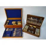 An Edwardian period oak canteen containing an extensive part set of OEP electroplated flatware for