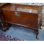 A George III mahogany blanket box on stand with brass strap hinges and lock plate raised on