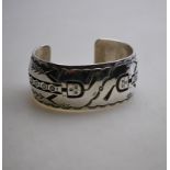 A Navajo silver bracelet, stamped R.H.