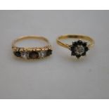 A five stone ring set with garnets and white paste,