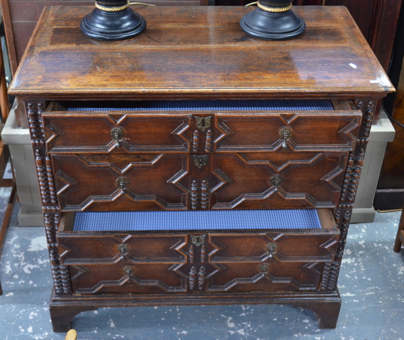 An early 18th century oak joined chest of four long graduated drawers, in two sections, - Image 2 of 2