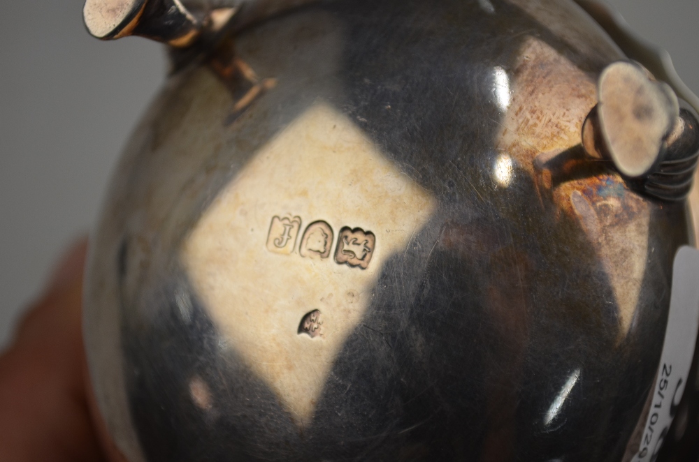 An Edwardian silver sauce boat with cut rim, scroll handle and hoof feet, Haseler Bros. - Image 3 of 4