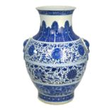 A blue and white vase with flaring trumpet neck,