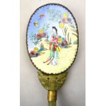 An oval mirror with Canton style enamel back,