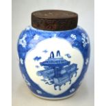 A blue and white oviform vase, decorated with panels depicting Scholar's objects,
