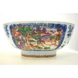 A famille rose bowl, decorated with two panels depicting Manchu/Chinese hunting scenes,