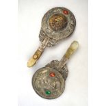 An associated pair of Chinese white metal hand mirrors;