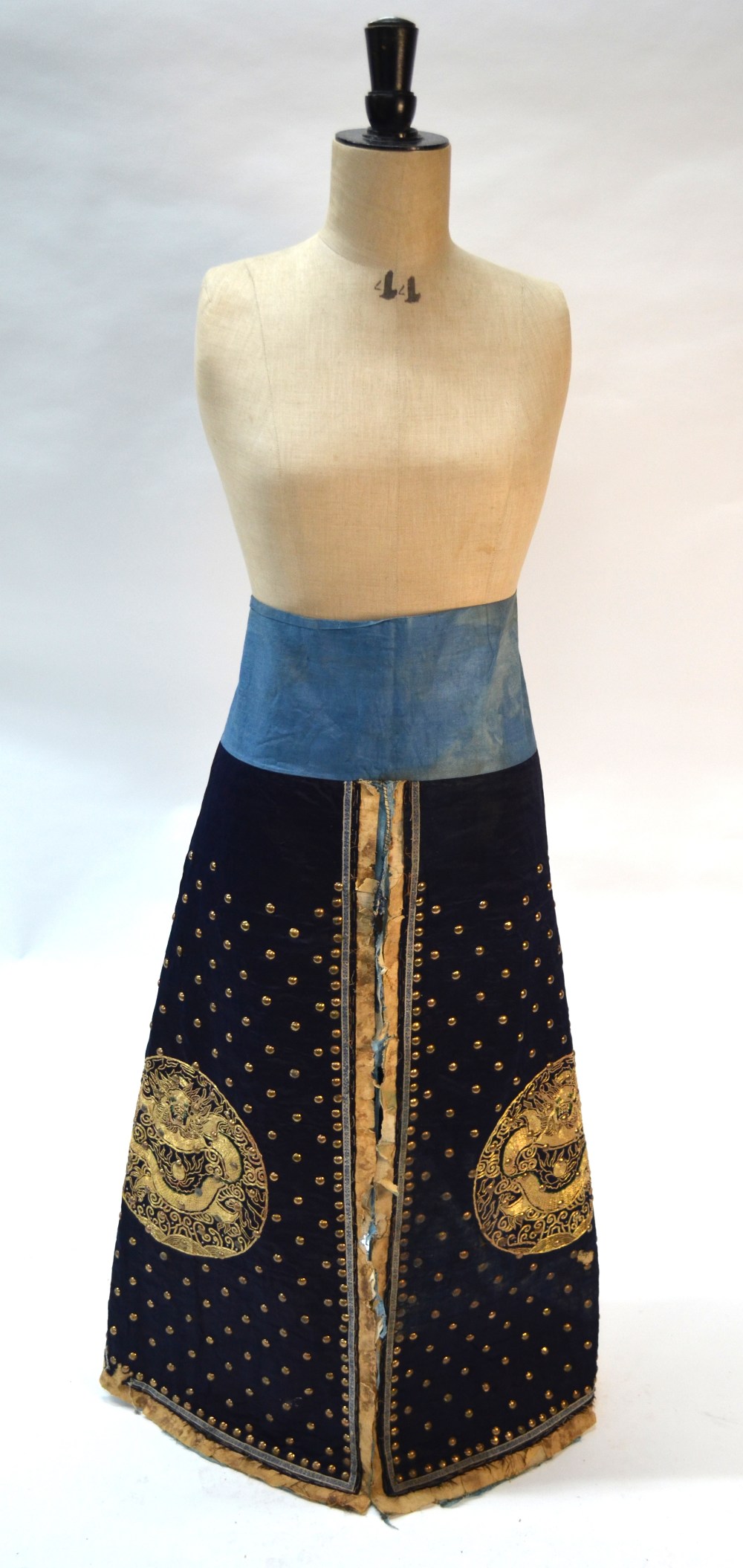 A blue-black ground leg-coat with gilt-metal studs; - Image 8 of 14