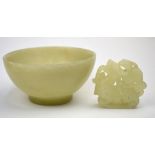 Two small green jade, or other, carvings: one a small bowl on circular foot,