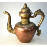 A Tibetan or Himalayan copper alloy teapot or ewer with animal handle and spout; 27cm high,