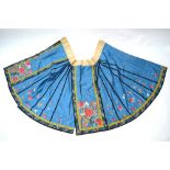 A Chinese silk skirt, decorated with floral designs and cotton waist band,