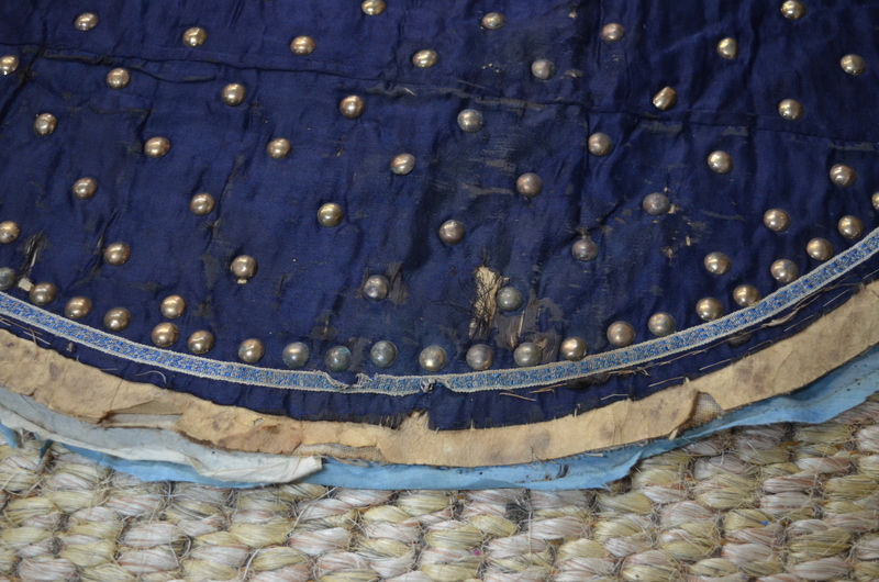 A blue-black ground leg-coat with gilt-metal studs; - Image 10 of 14