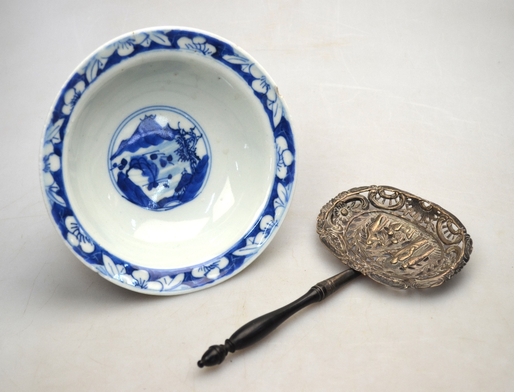 A blue and white bowl decorated on the exterior with three scholars,