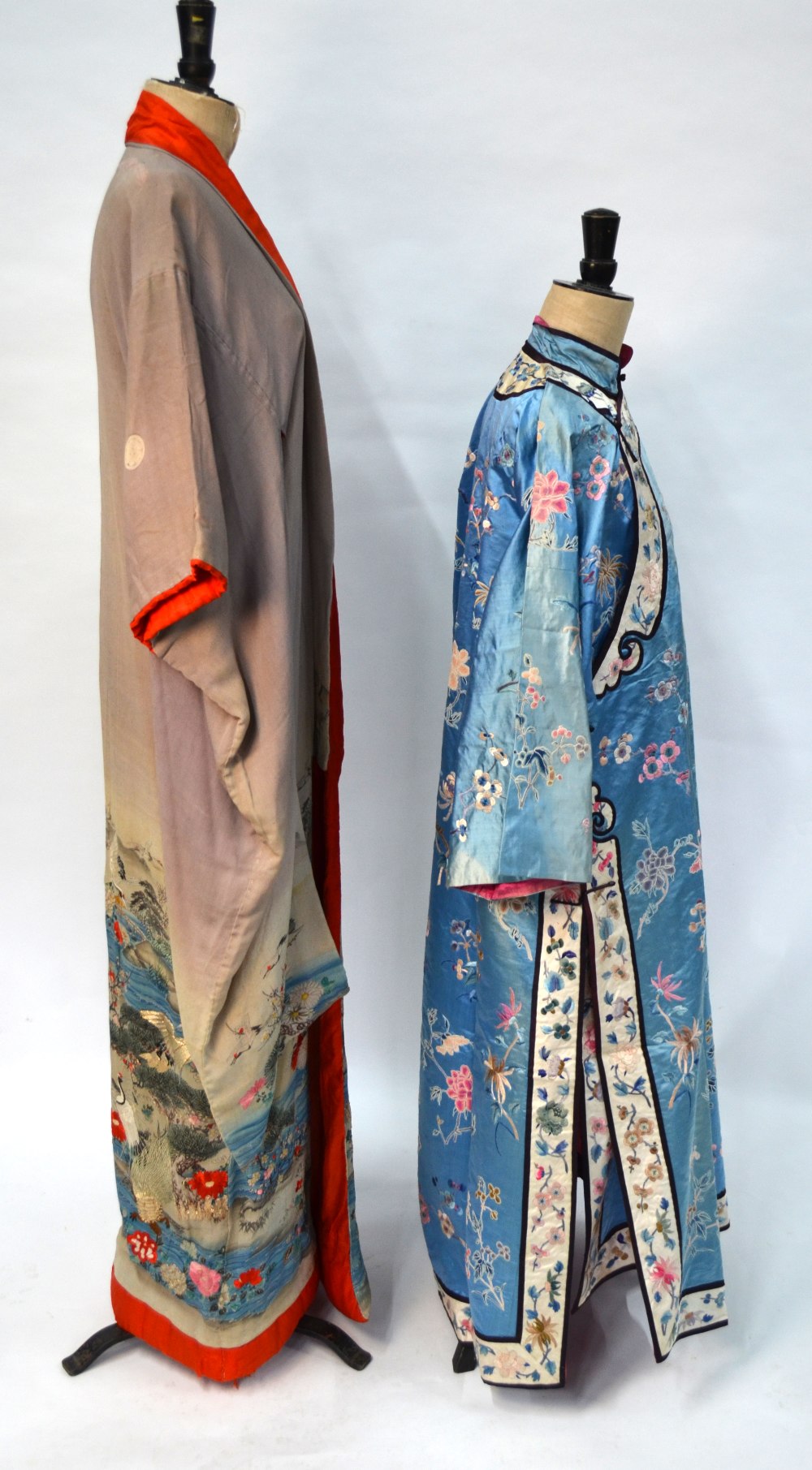 A Chinese blue silk robe embroidered with flowering prunus, japonica and tree peonies, - Image 2 of 8