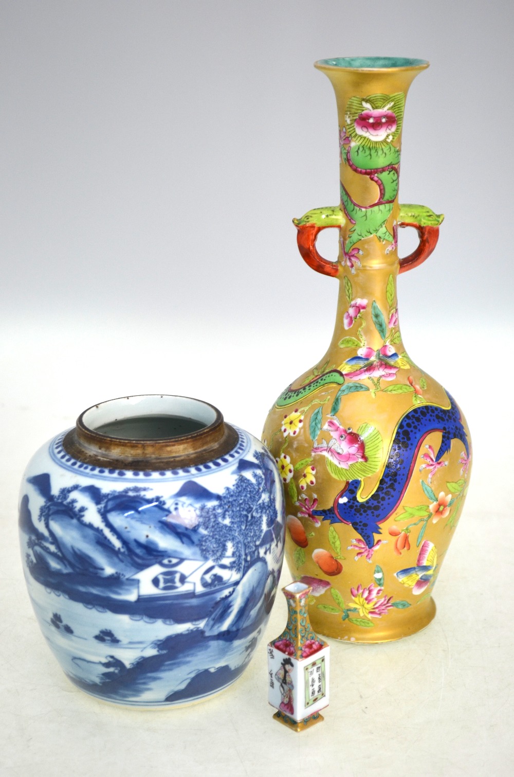 A miniature famille rose vase with unglazed base, 7cm high; together with another famille rose vase,