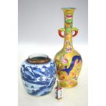 A miniature famille rose vase with unglazed base, 7cm high; together with another famille rose vase,