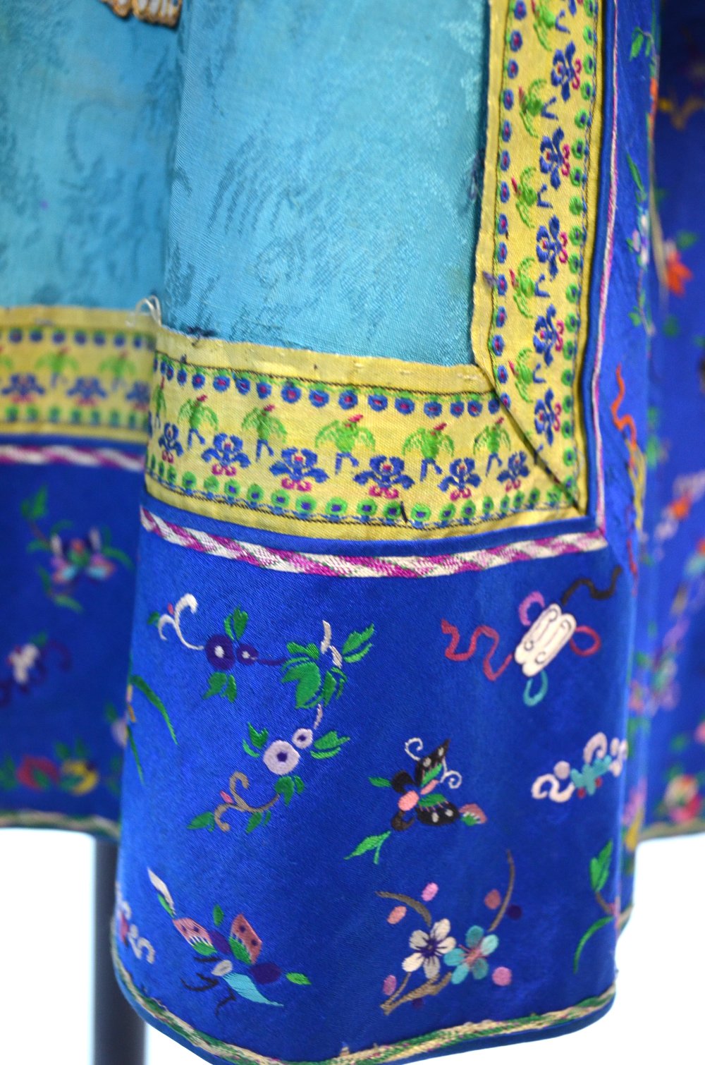 A turquoise-green Chinese coat decorated with peaches and six applique elephants; about 93 cm long, - Image 4 of 4