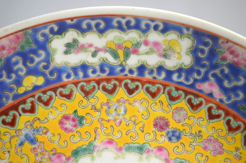 A famille rose dish, decorated with a central design of Manchu/Chinese boys at play; 29. - Image 3 of 5