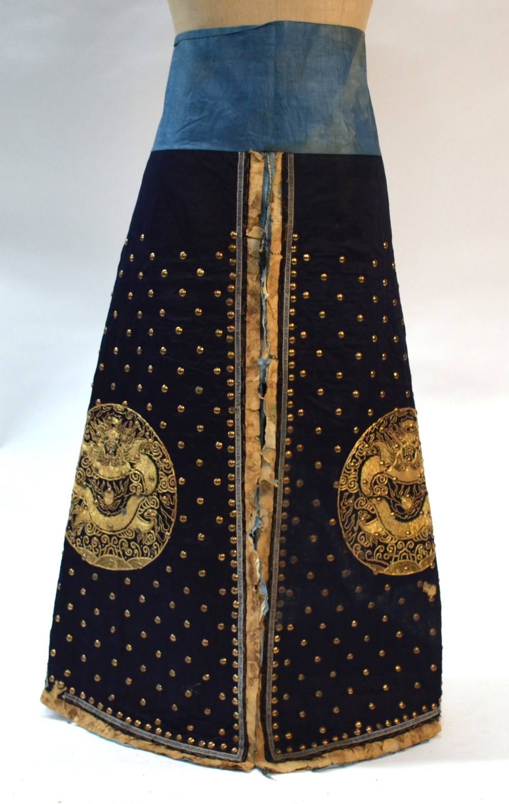 A blue-black ground leg-coat with gilt-metal studs; - Image 2 of 14