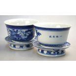 A pair of blue and white bowls and stands, 10cm diameter,