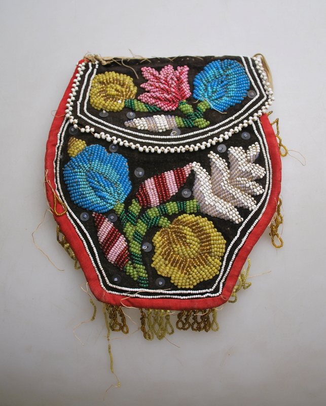 A Native American, bead decorated red te - Image 2 of 2