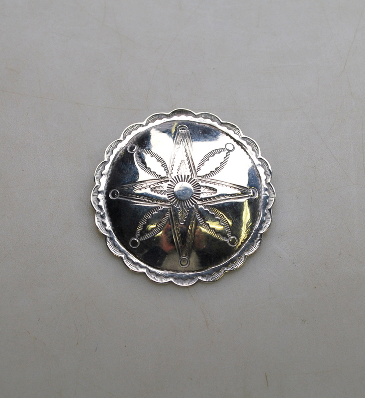 A large Navajo silver button with stampe