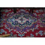 An old Persian Kirman carpet, the floral