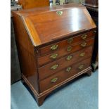 A 19th century mahogany bureau, the fall