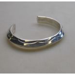 A Navajo silver bracelet of triangular c