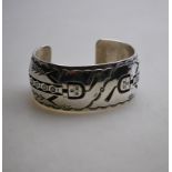 A Navajo silver bracelet, stamped R.H.Be