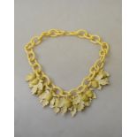 A vintage celluloid/bakelite necklace of oak leaves and acorns with hook fastener