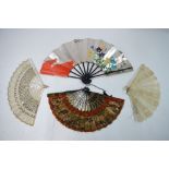 An early 20th century mother of pearl fan, the silk leaf with painted decoration and silver sequins,