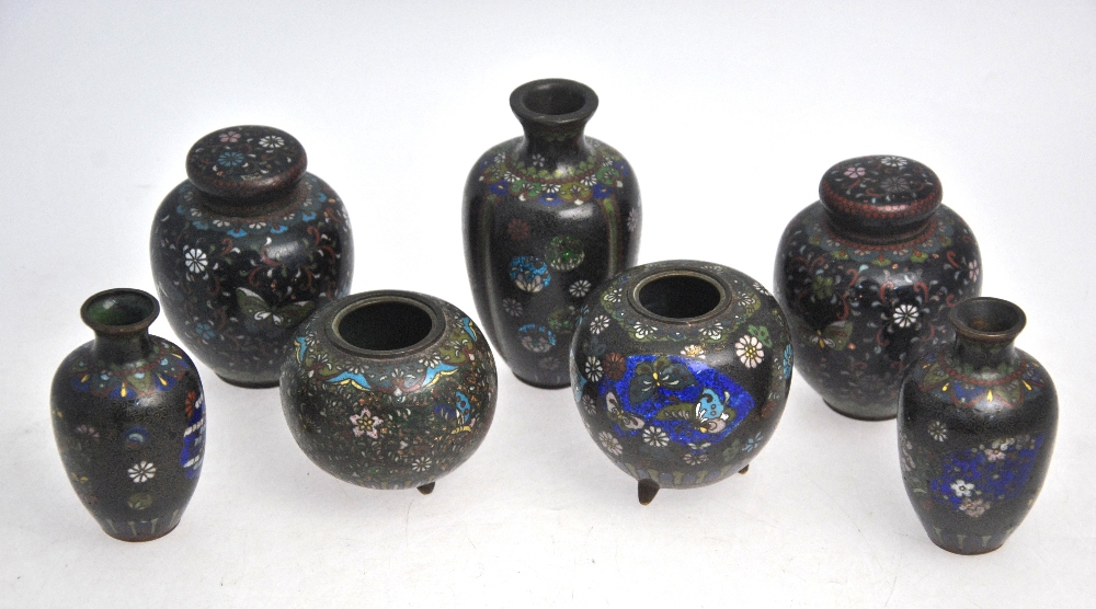 Seven small cloisonne enamel vases, the tallest 12 cm high,