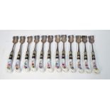 A set of one dozen shaped spoons with floral decorated porcelain pistol grip handles (12)