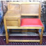 Wild 'Squirrel Man' Hutchinson oak telephone seat/table with studded red leather seat,