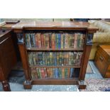 A late 19th/20th century Egyptian Revival ebony crossbanded inverted breakfront open low bookcase,