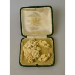 An antique ivory demi parure of a carved floral bouquet and drop earrings (2) Condition