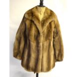 A shadowed light brown fur jacket retailed by furriers 'Sacks & Brendlor', 46 cm across chest,
