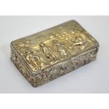 An Edwardian silver picture-top snuff box, the hinged cover embossed with rustic revellers,