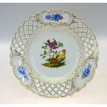 A Meissen cabinet plate with reticulated rim, painted to the centre with fancy birds,